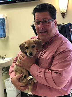 Cary Child Chiropractor Christopher Outten with dog
