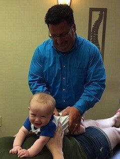 Dr. Outten Chiropractic Adjustment on baby in Cary, NC
